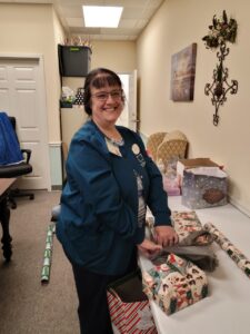 Office staff wrapping presents at TenderHeearted Home Care