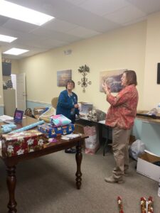 Office staff wrapping presents at TenderHeearted Home Care