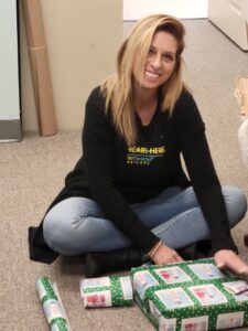 Office staff wrapping presents at TenderHeearted Home Care